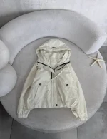 Women's bomber raincoat, free size 38-44, 60 cm length, available in black and cream